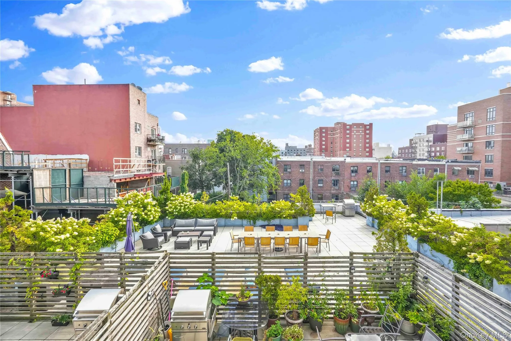 Surrounding community with outdoor lounge area, a patio area, a city view, and exterior kitchen Surrounding community with outdoor lounge area, a patio area, a city view, and exterior kitchen