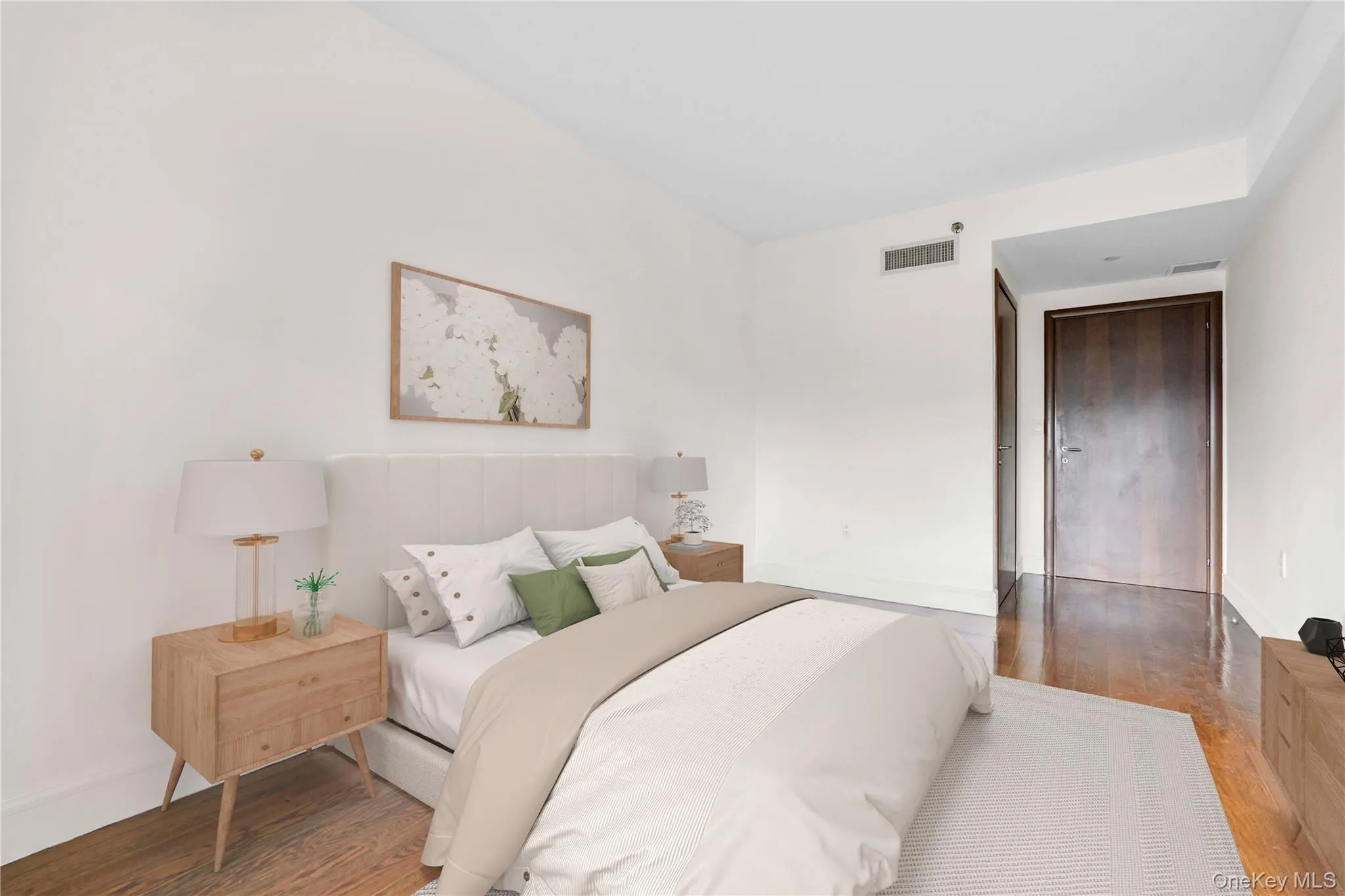 Bedroom with wood finished floors and baseboards Bedroom with wood finished floors and baseboards