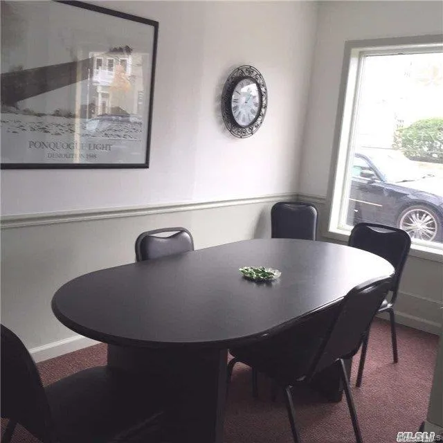 Dining area featuring carpet flooring and baseboards Dining area featuring carpet flooring and baseboards