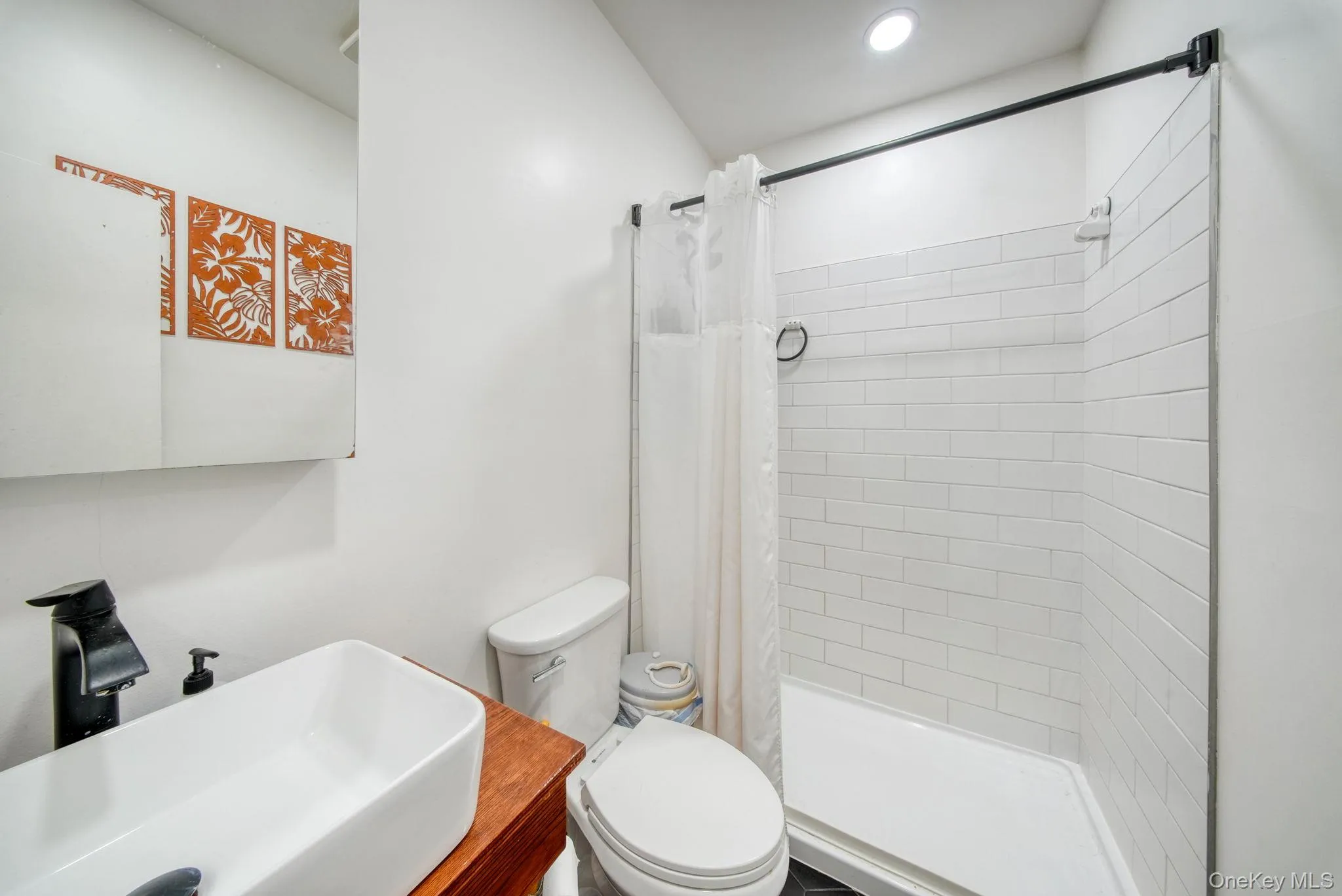Full bath with a sink and a stall shower Full bath with a sink and a stall shower