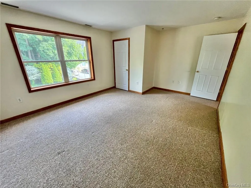 View of carpeted empty room View of carpeted empty room