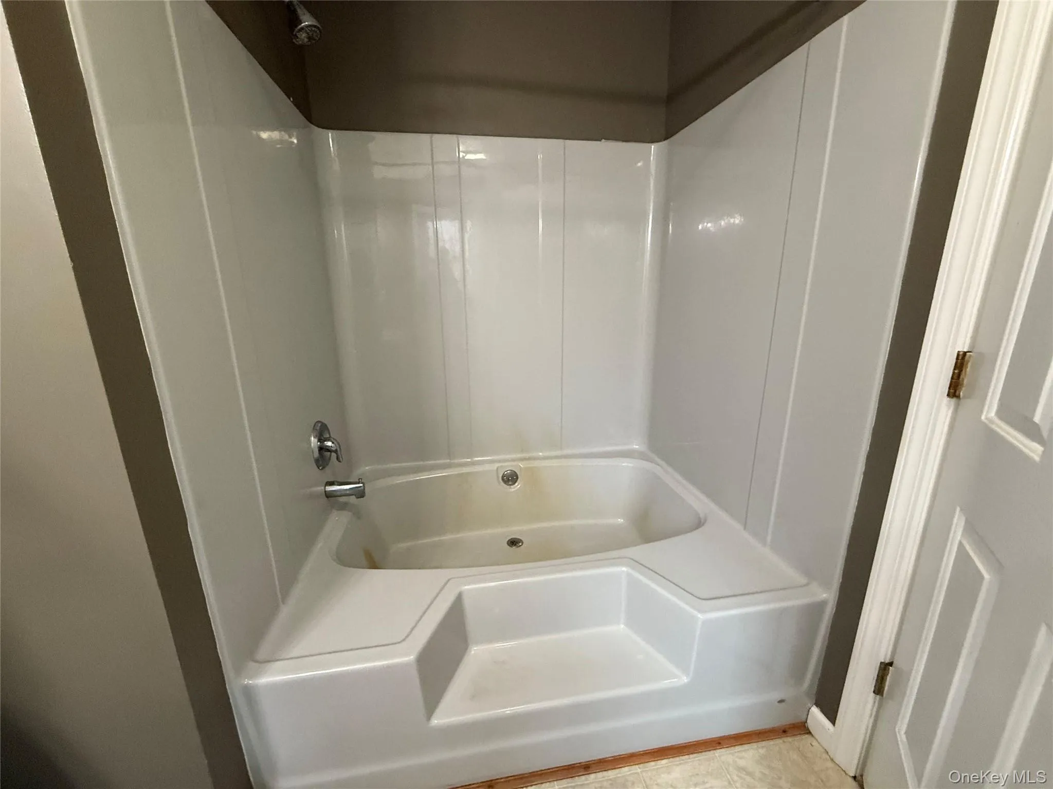 Bathroom featuring shower / bath combination Bathroom featuring shower / bath combination