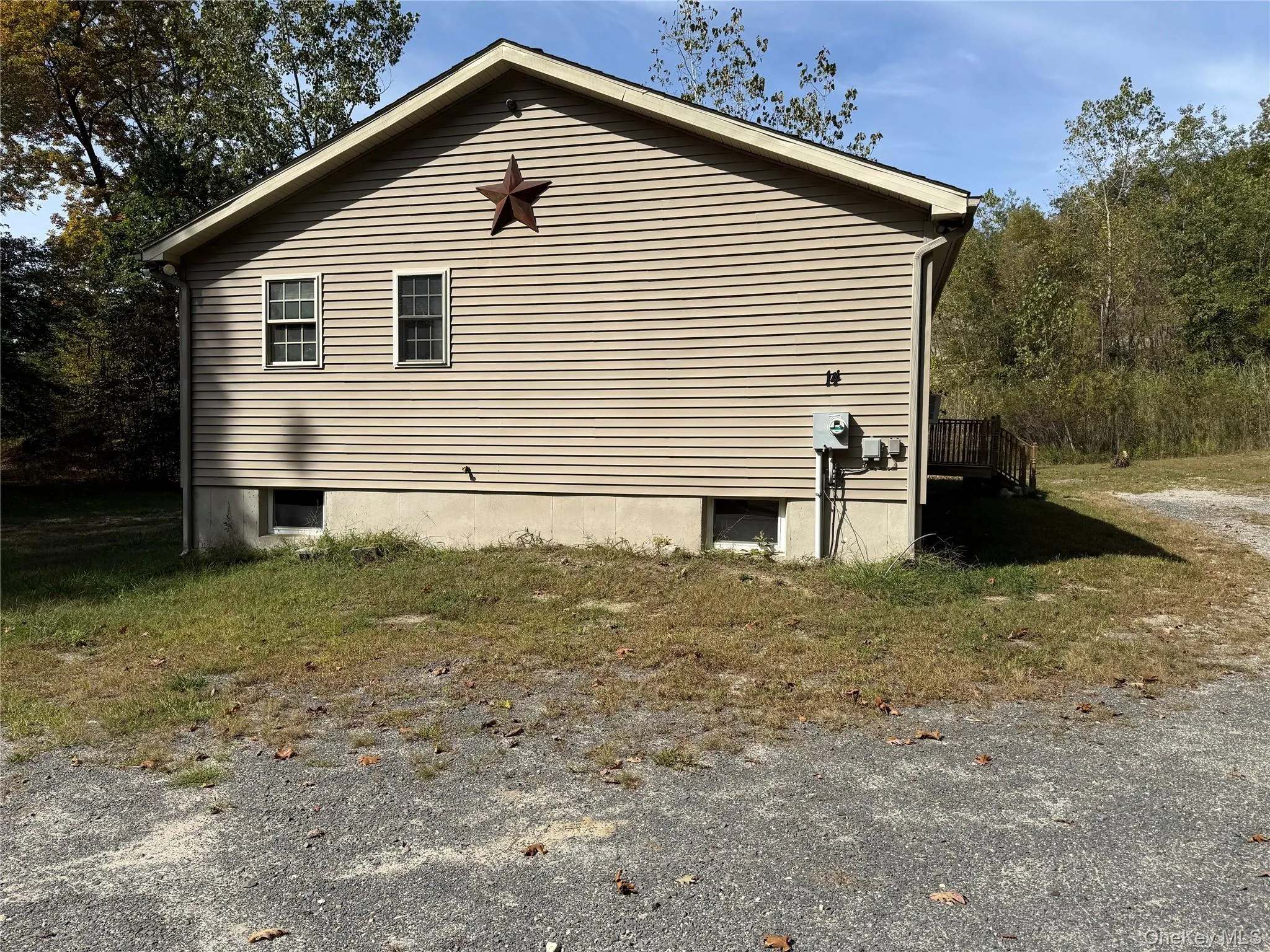View of home's exterior with a deck View of home's exterior with a deck