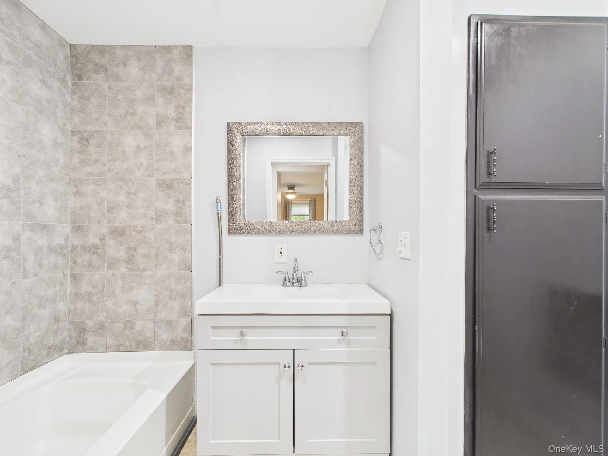 Bathroom featuring vanity and shower combination Bathroom featuring vanity and shower combination