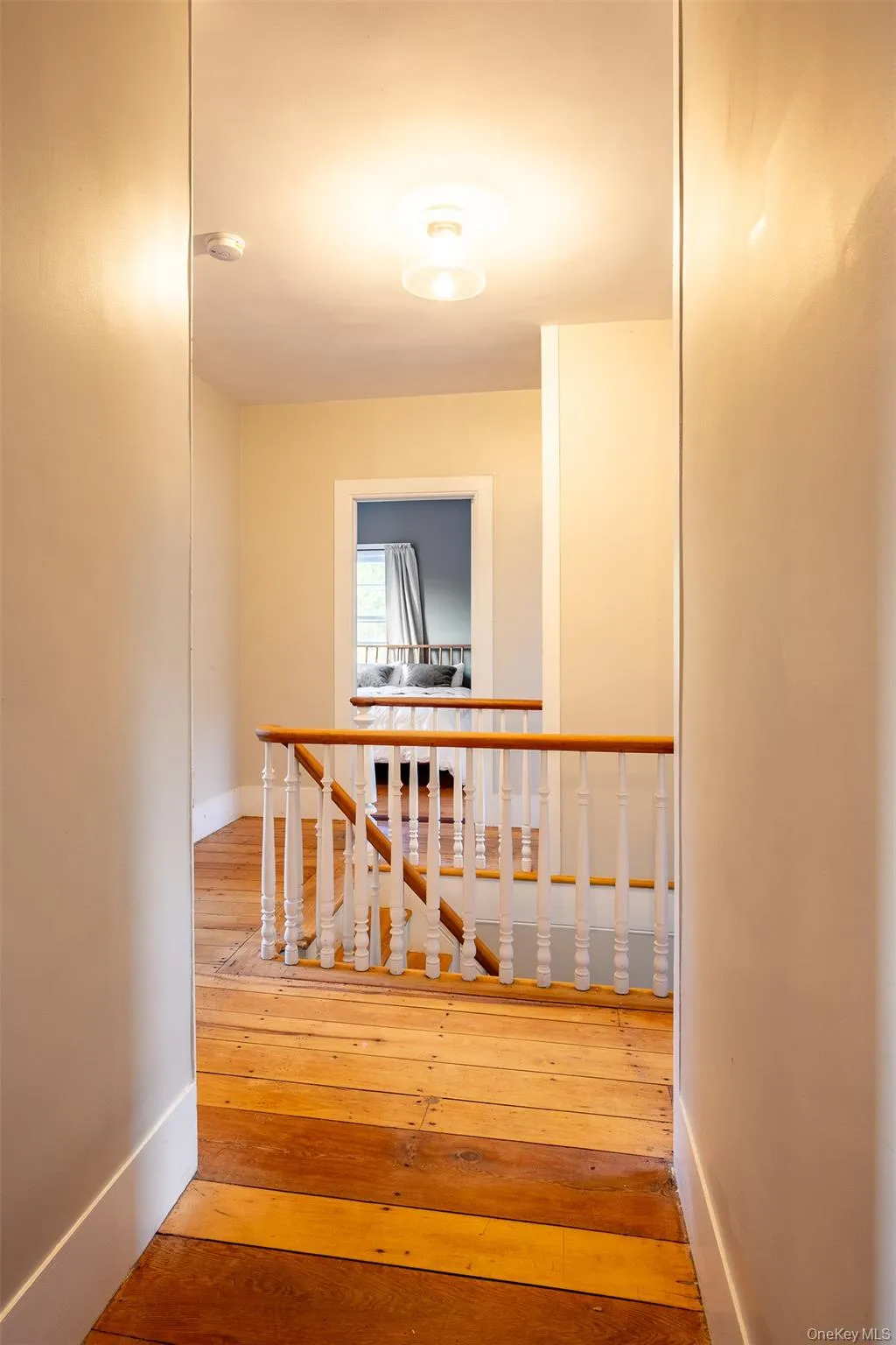 Staircase with hardwood / wood-style floors and baseboards Staircase with hardwood / wood-style floors and baseboards