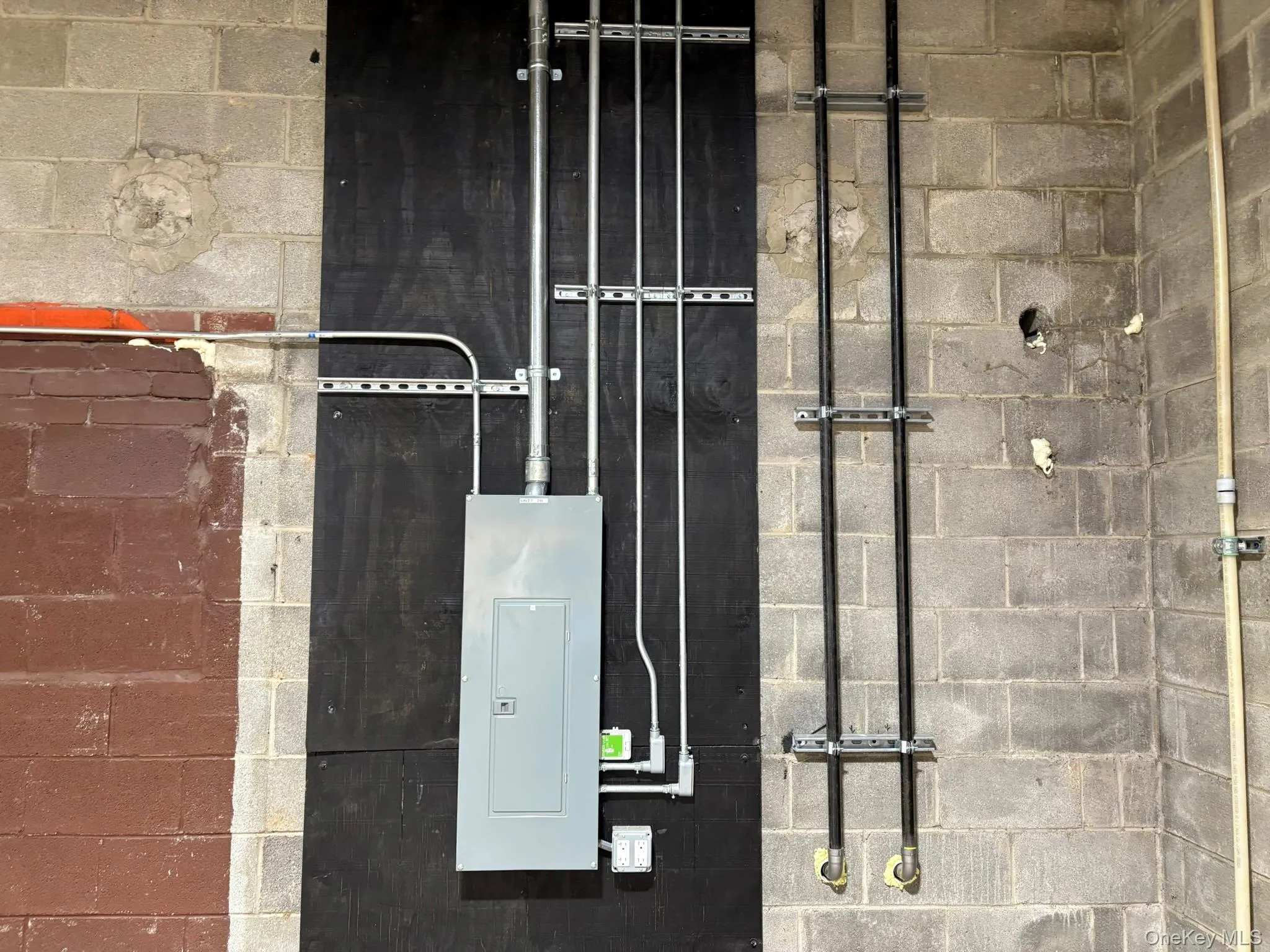 Utility room with electric panel Utility room with electric panel