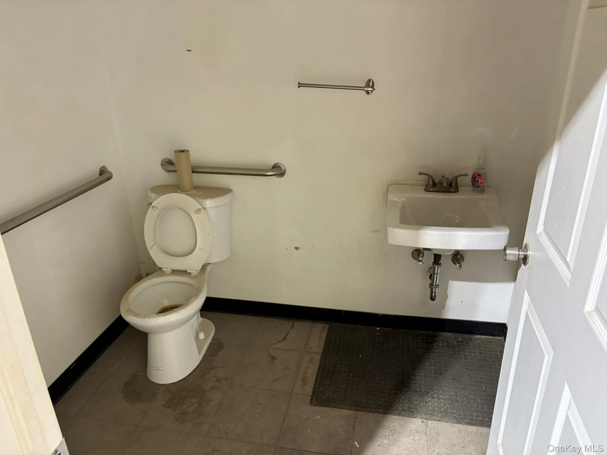 Bathroom with toilet and baseboards Bathroom with toilet and baseboards
