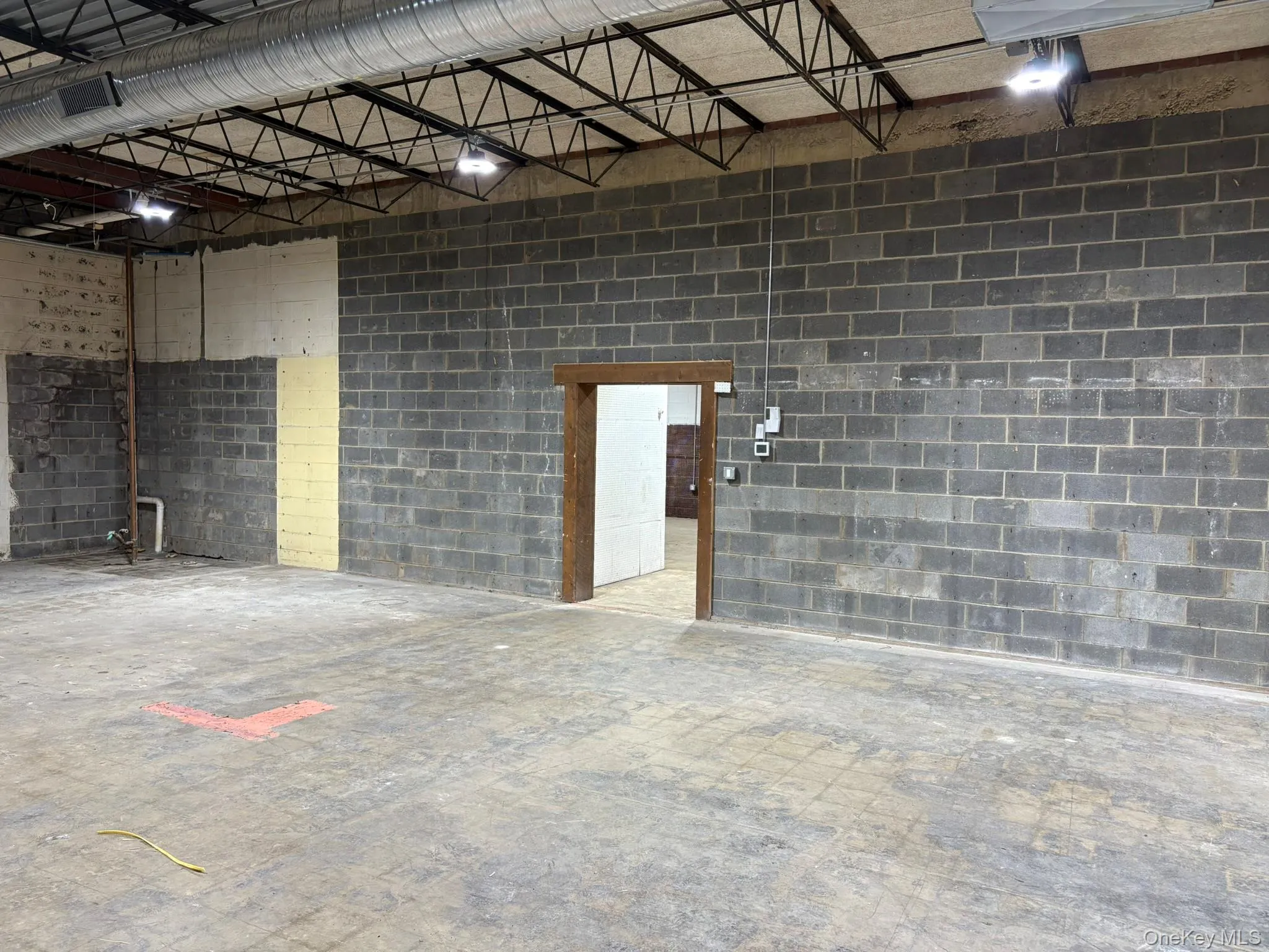 Garage featuring concrete block wall Garage featuring concrete block wall