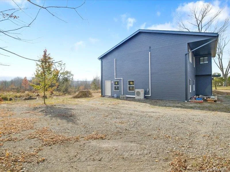 View of home's exterior featuring an ac unit View of home's exterior featuring an ac unit