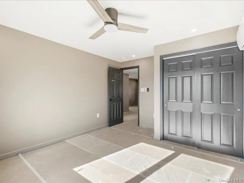 Unfurnished bedroom featuring a closet, ceiling fan, and recessed lighting Unfurnished bedroom featuring a closet, ceiling fan, and recessed lighting