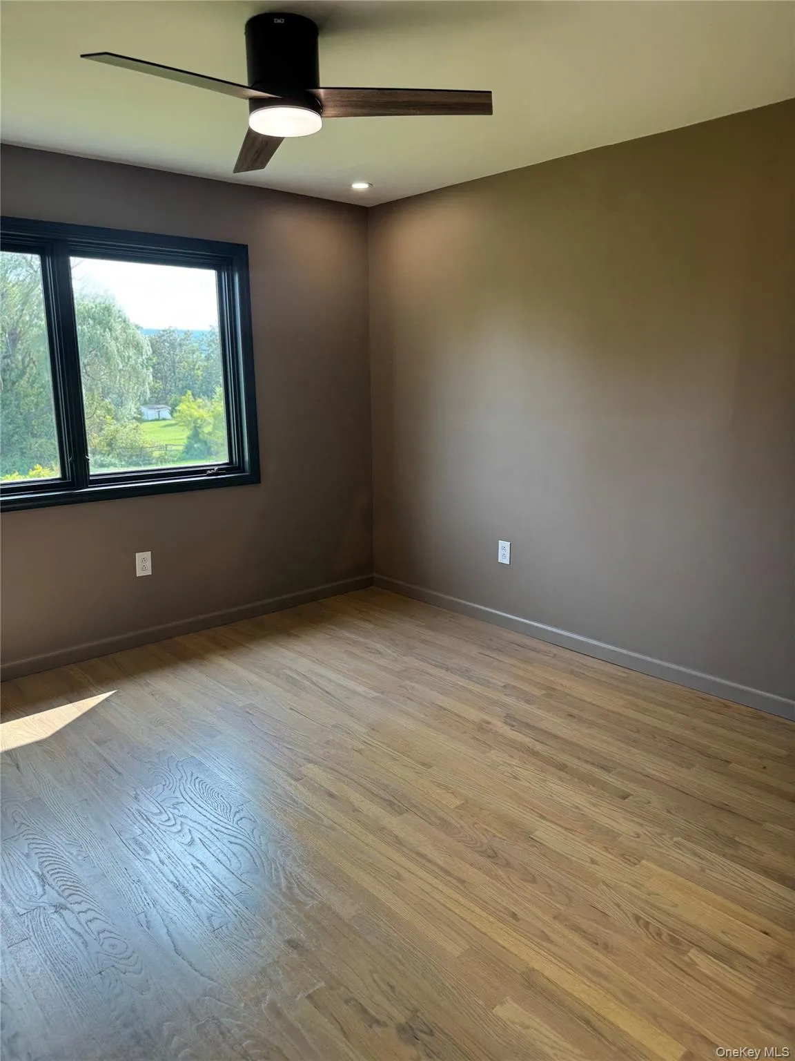 Empty room featuring light wood finished floors, a ceiling fan, and recessed lighting Empty room featuring light wood finished floors, a ceiling fan, and recessed lighting