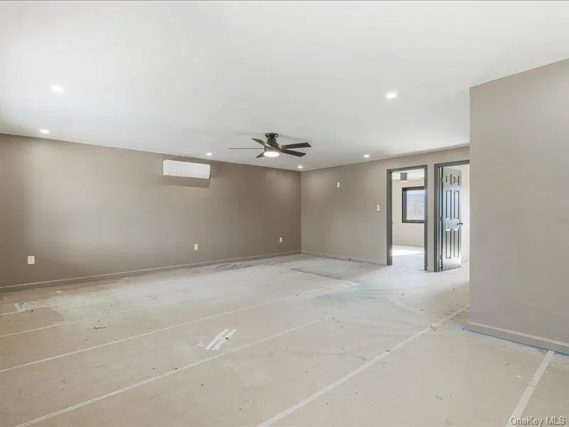 Empty room featuring a ceiling fan and recessed lighting Empty room featuring a ceiling fan and recessed lighting