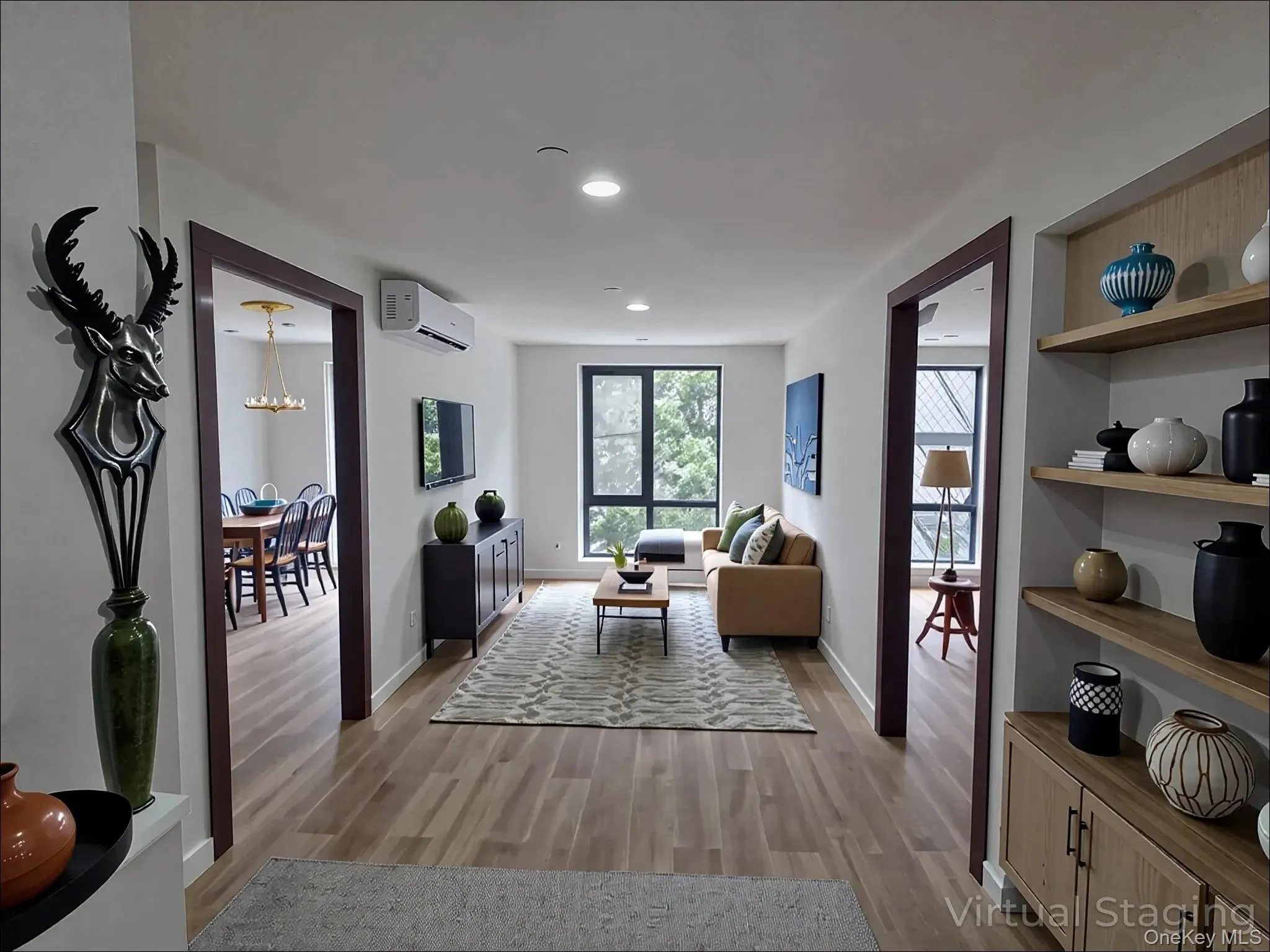 Sitting room featuring light wood-style flooring, a chandelier, and recessed lighting Sitting room featuring light wood-style flooring, a chandelier, and recessed lighting