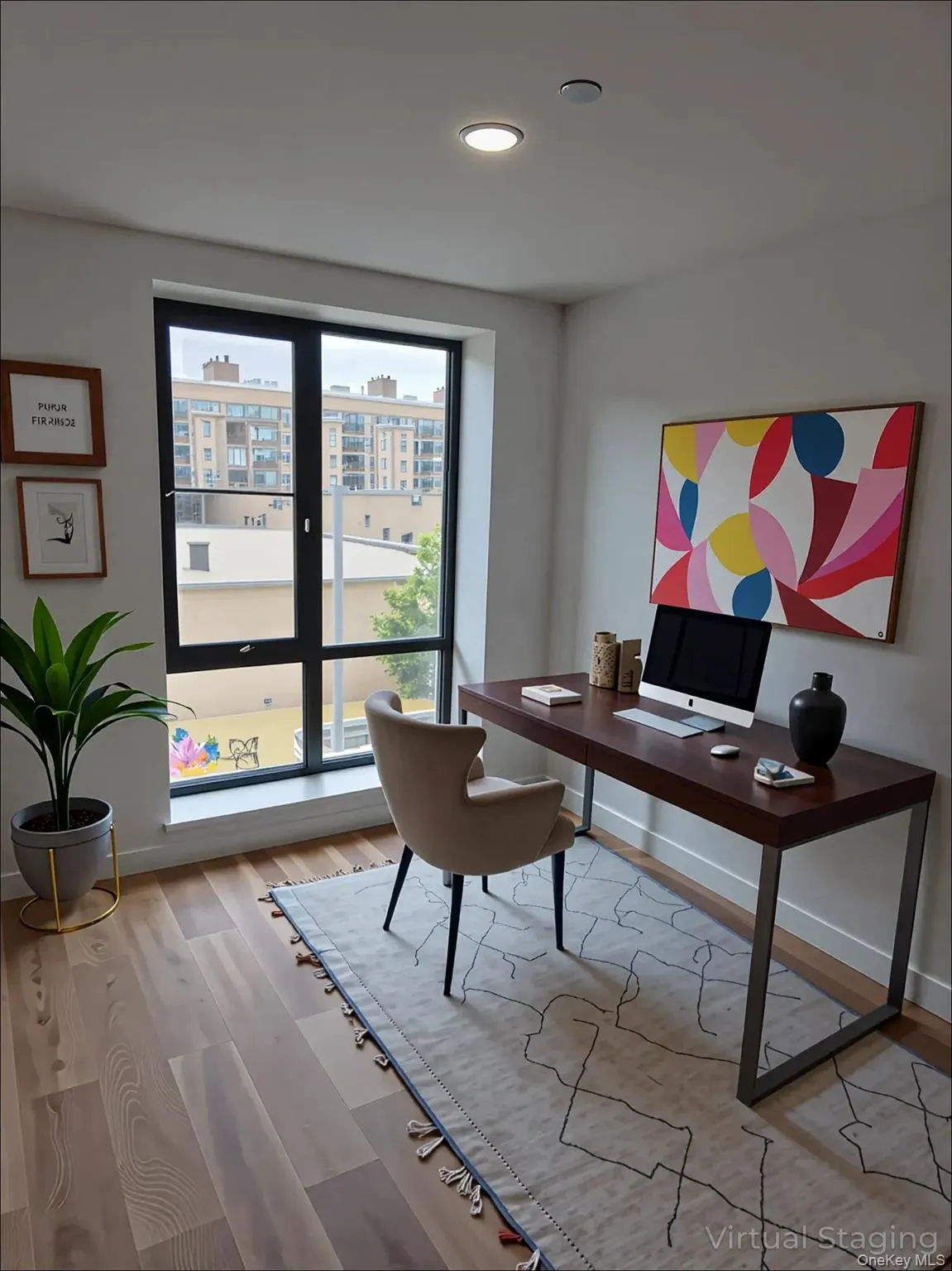 Office with light wood-style floors and recessed lighting Office with light wood-style floors and recessed lighting