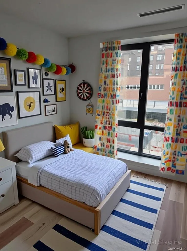Bedroom featuring wood finished floors Bedroom featuring wood finished floors