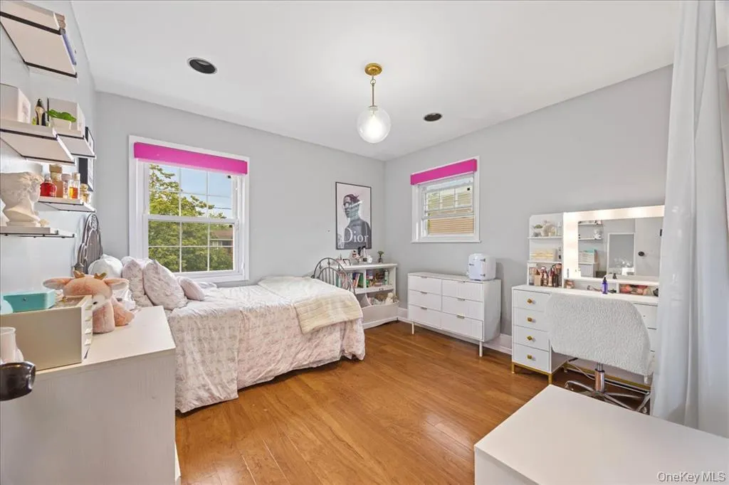Bedroom featuring light wood-style floors Bedroom featuring light wood-style floors