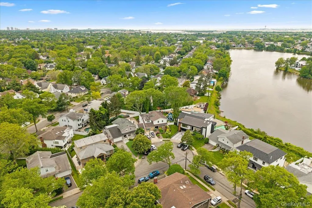 Aerial view of residential area with a nearby body of water Aerial view of residential area with a nearby body of water
