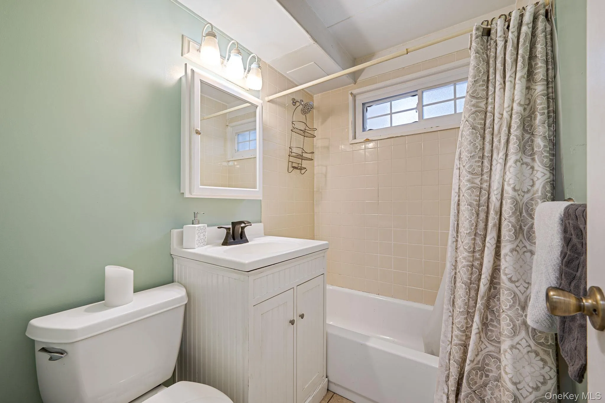 Bathroom with shower / bath combo and vanity Bathroom with shower / bath combo and vanity