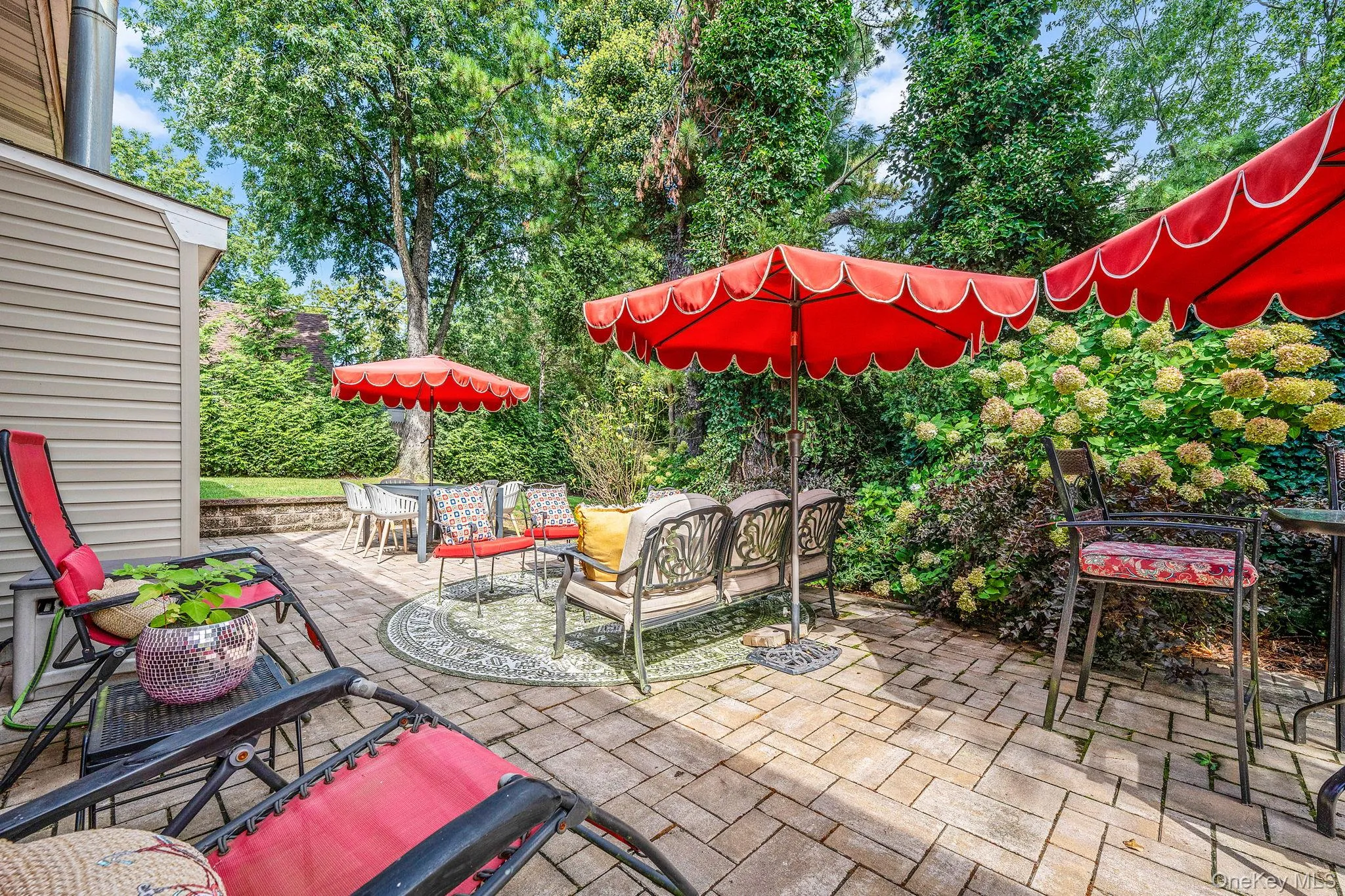 View of patio / terrace featuring an outdoor hangout area and outdoor dining space View of patio / terrace featuring an outdoor hangout area and outdoor dining space