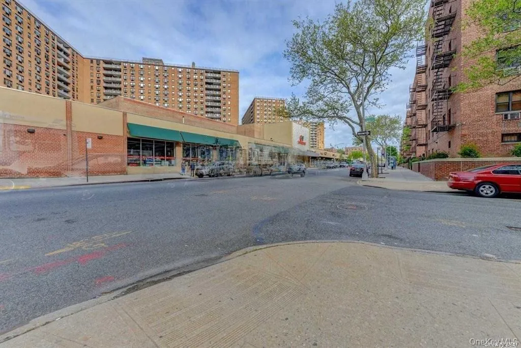 View of asphalt street with sidewalks, curbs, and street lights View of asphalt street with sidewalks, curbs, and street lights