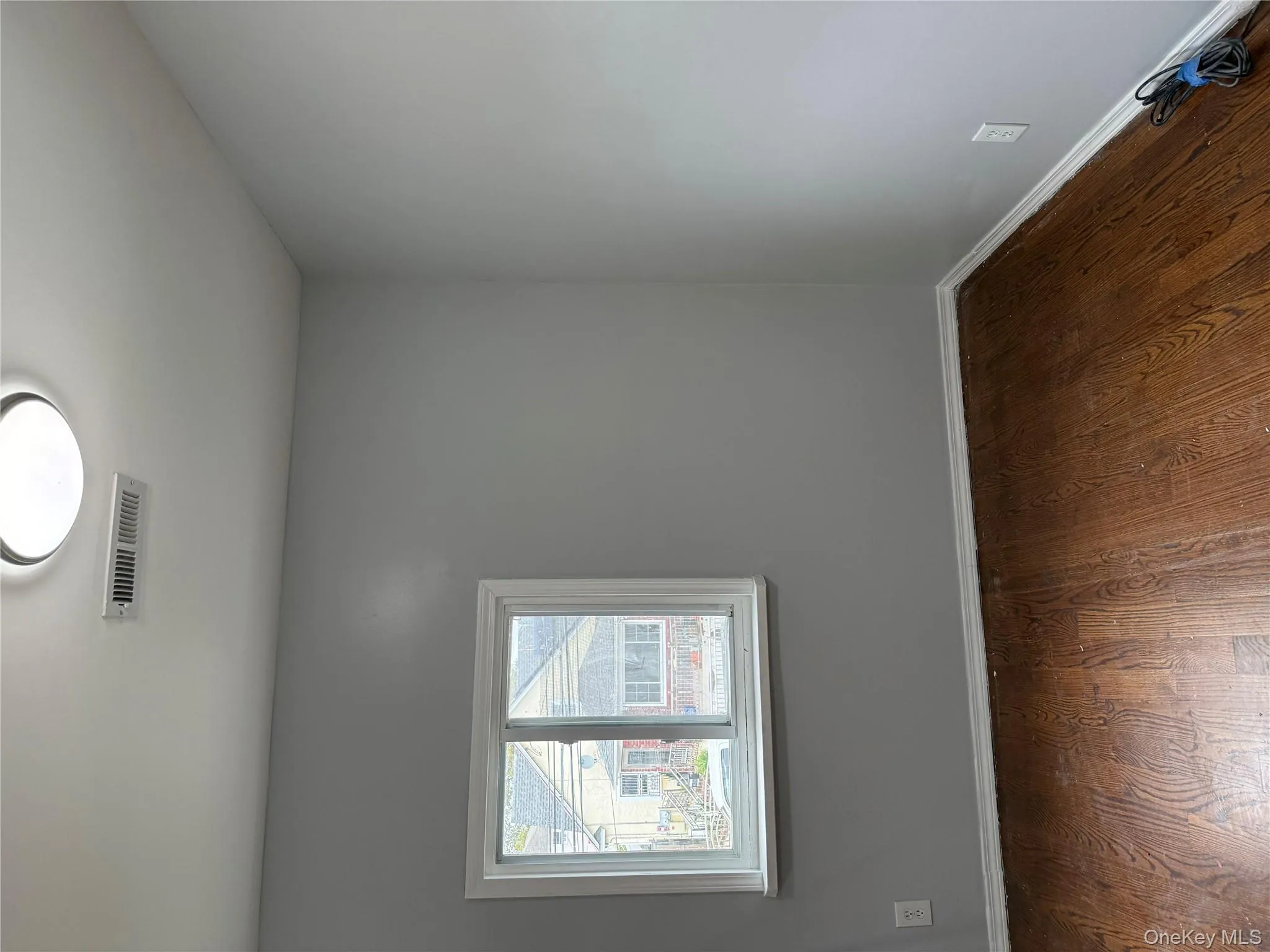 Spare room with baseboards and dark wood finished floors Spare room with baseboards and dark wood finished floors