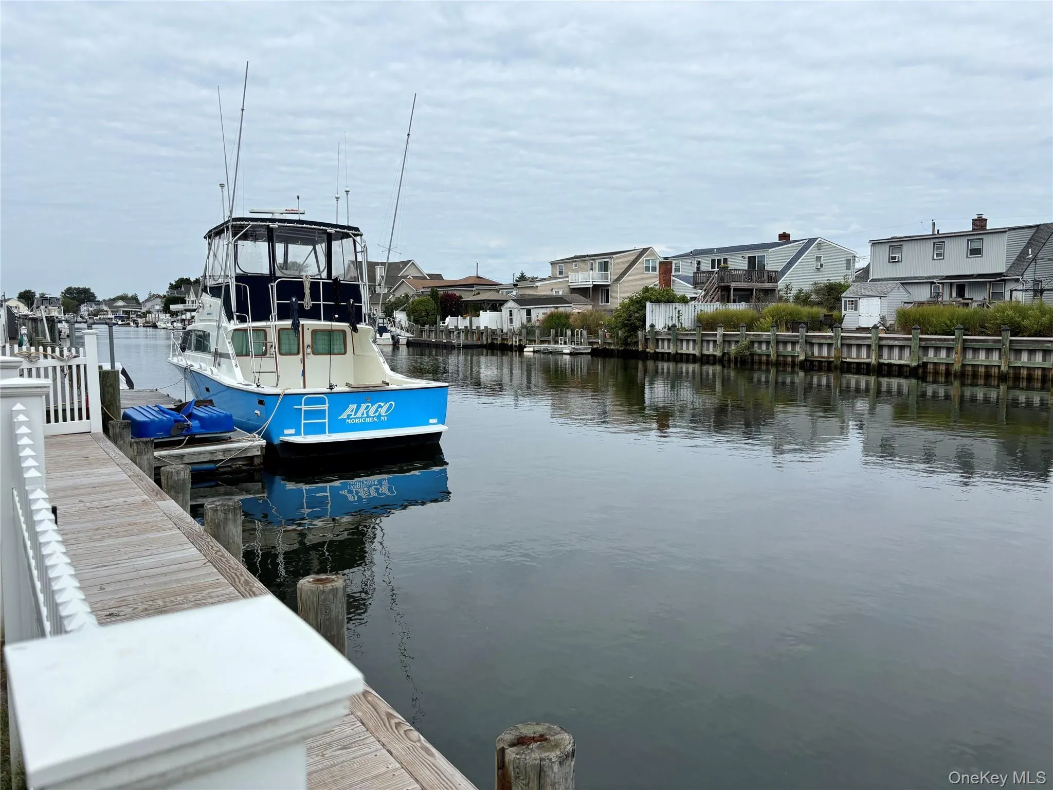 Dock area featuring a water view and a residential view Dock area featuring a water view and a residential view