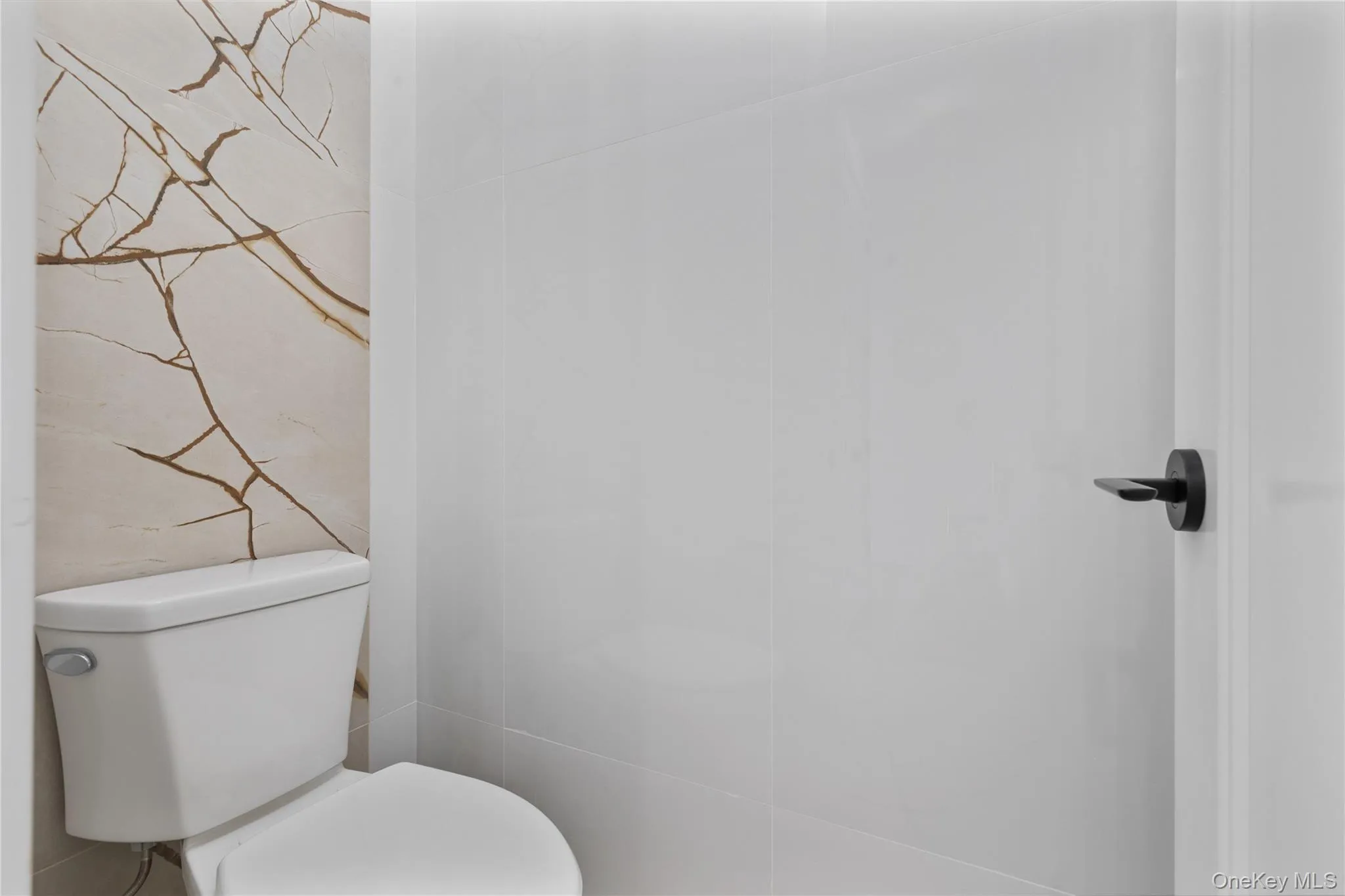 Bathroom featuring toilet Bathroom featuring toilet