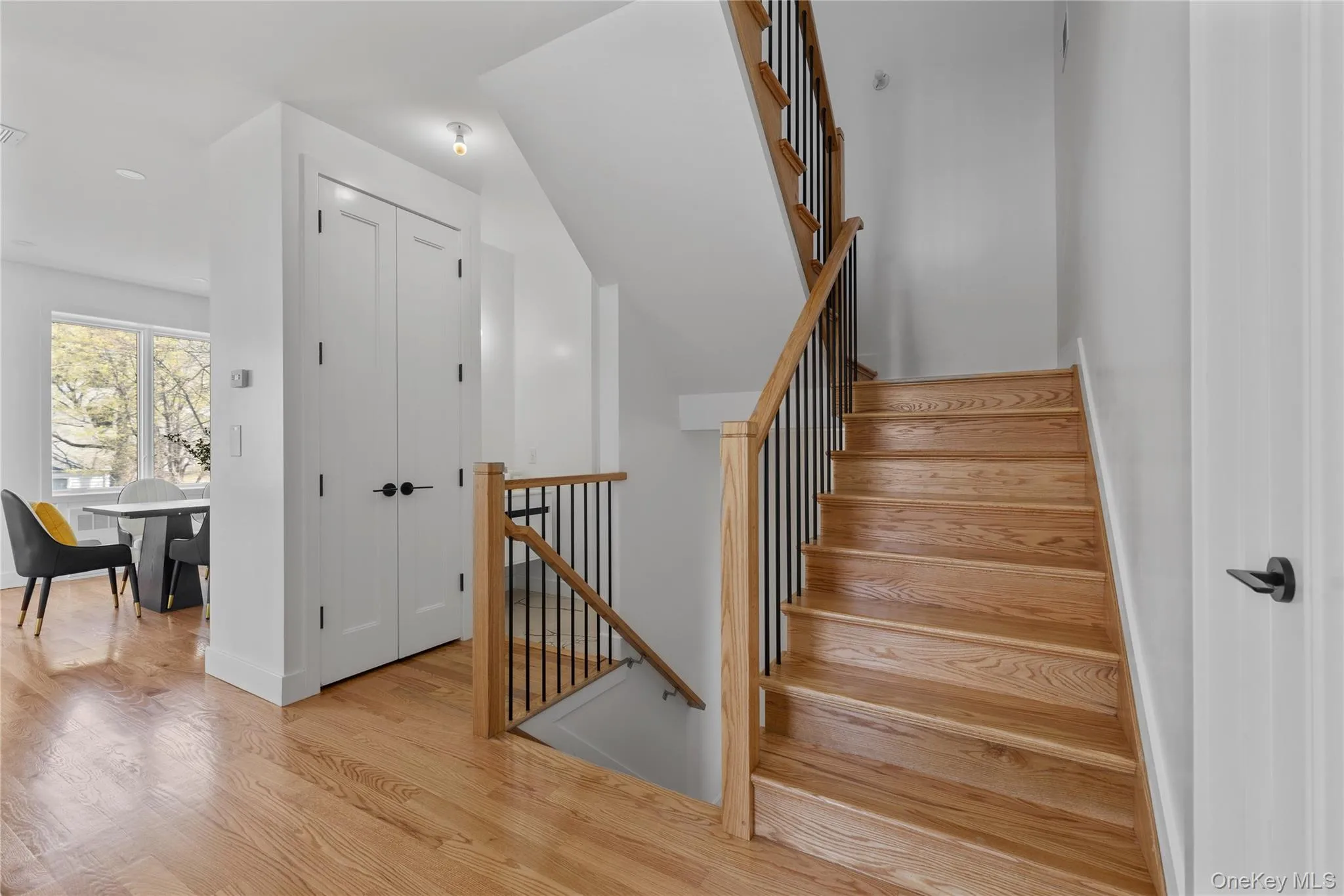 Staircase featuring baseboards and wood finished floors Staircase featuring baseboards and wood finished floors