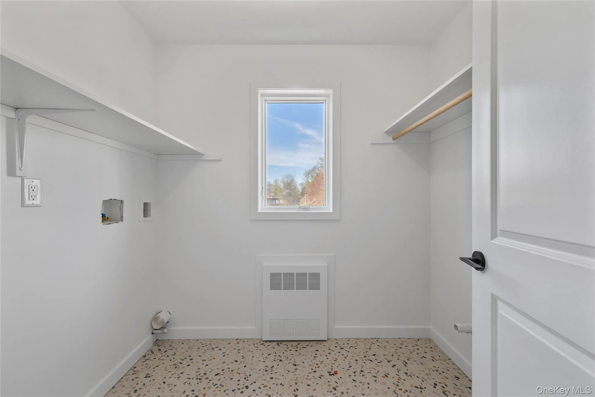 Laundry area featuring washer hookup, visible vents, baseboards, and laundry area Laundry area featuring washer hookup, visible vents, baseboards, and laundry area