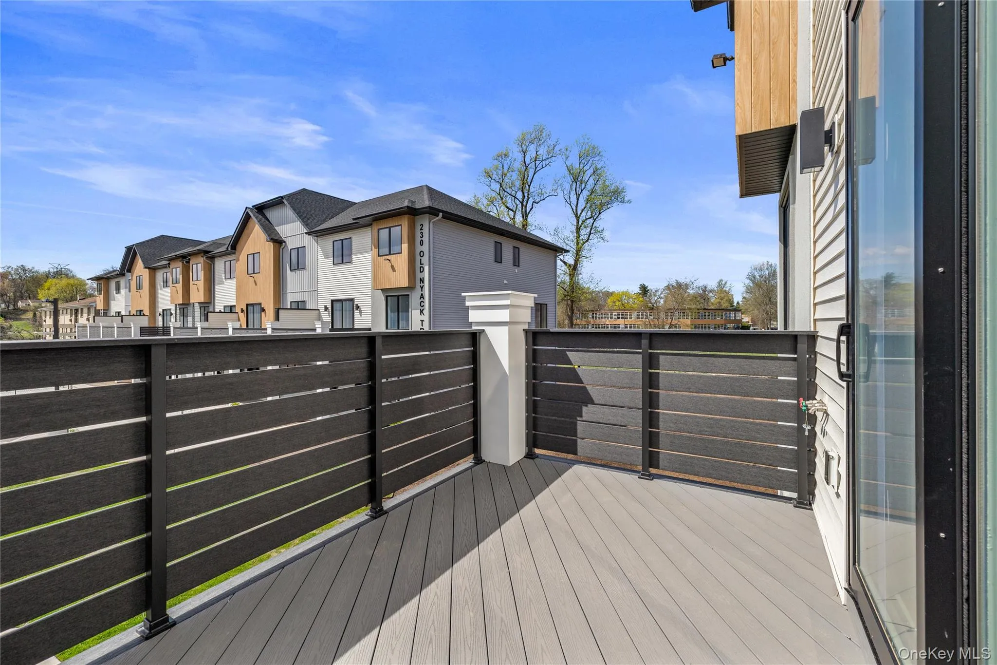 Wooden terrace with a residential view Wooden terrace with a residential view