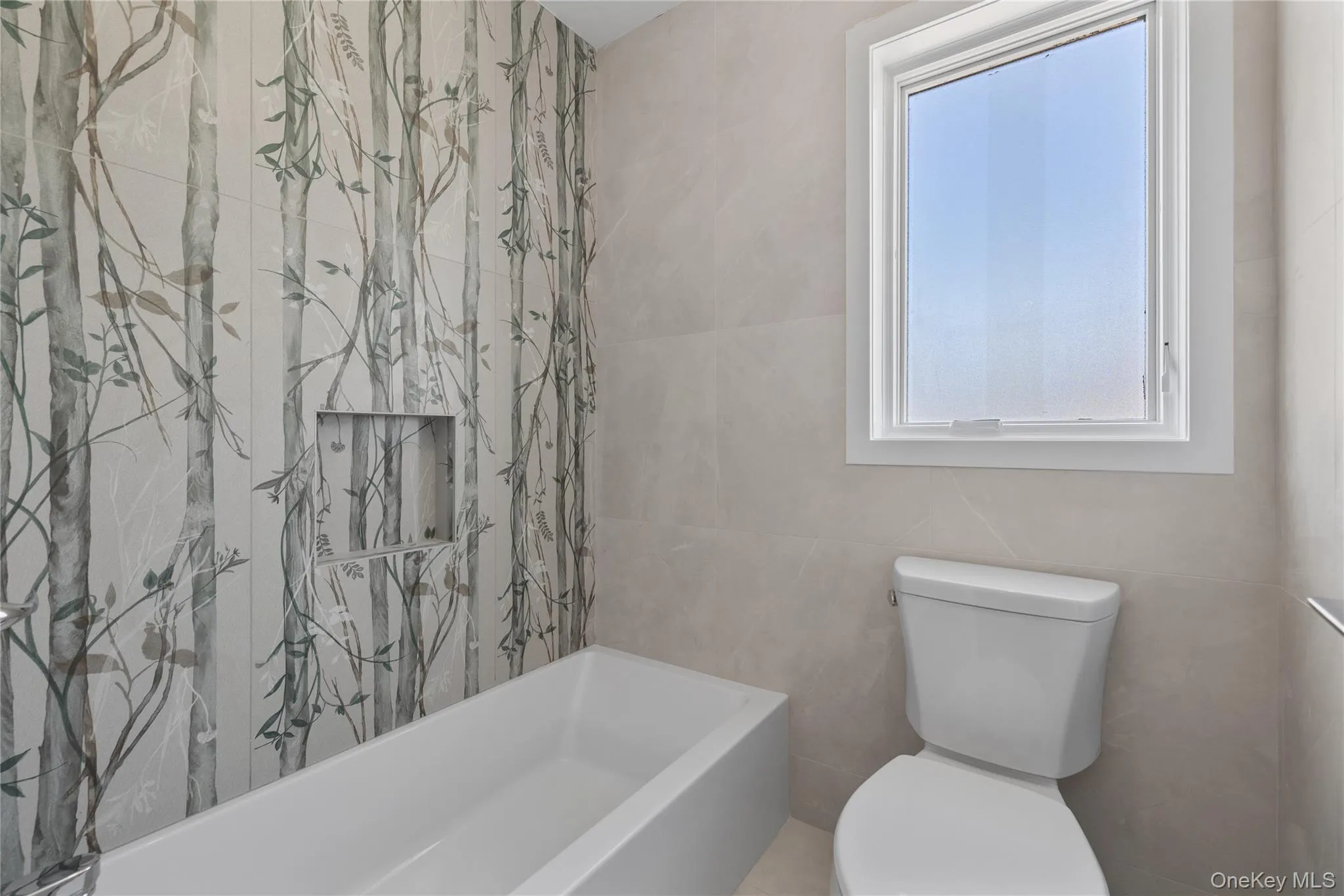 Bathroom with toilet and tile walls Bathroom with toilet and tile walls