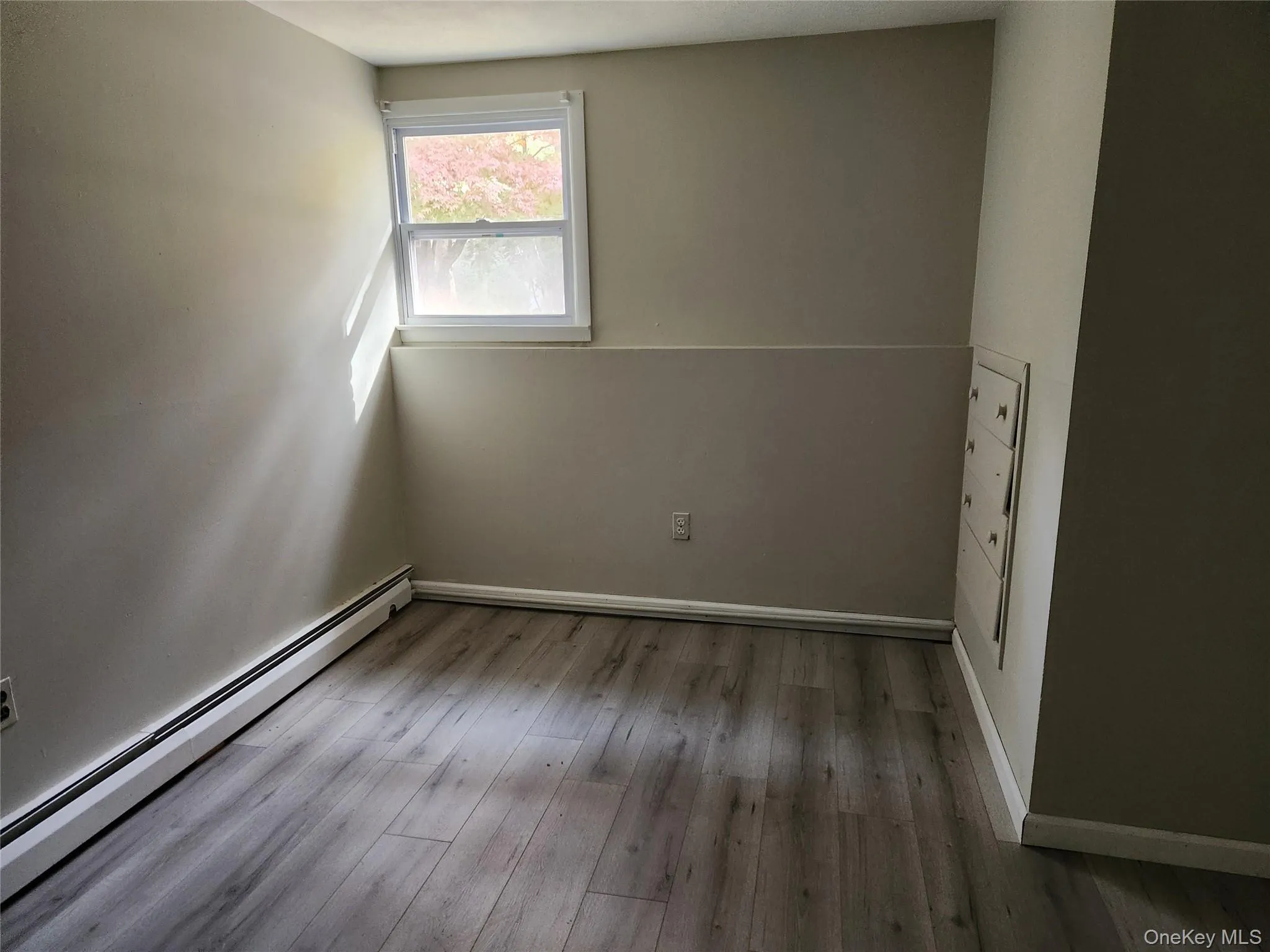 Home Office with baseboard heating and Laminate flooring Home Office with baseboard heating and Laminate flooring