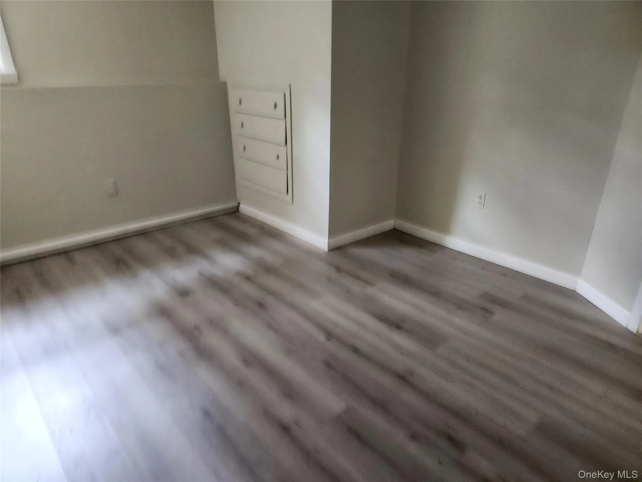 Office or Hobby Room featuring Laminate Flooring Window and a Closet Office or Hobby Room featuring Laminate Flooring Window and a Closet