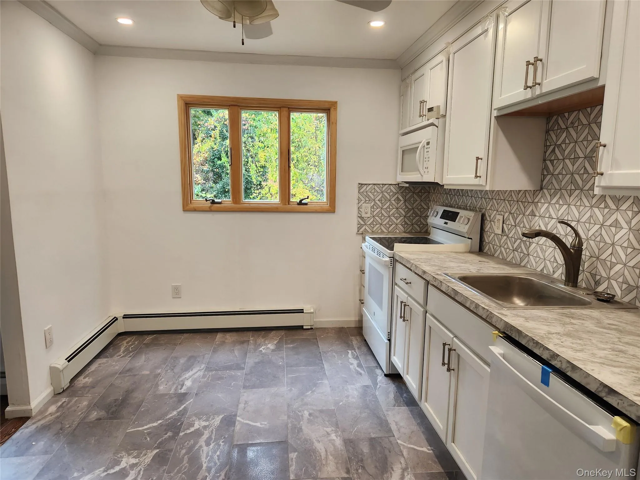 Granite Countertops tile backsplash, laminate flooring and newer appliances Granite Countertops tile backsplash, laminate flooring and newer appliances