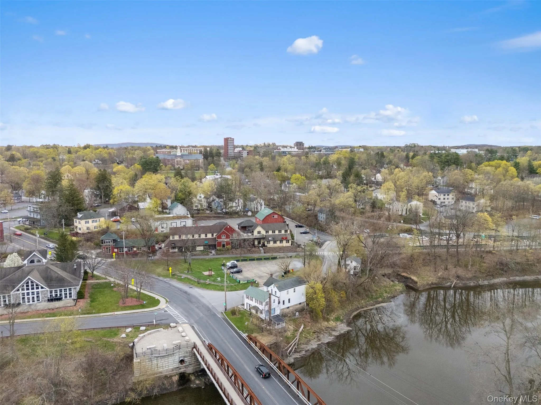 Aerial view of property's location with a large body of water Aerial view of property's location with a large body of water