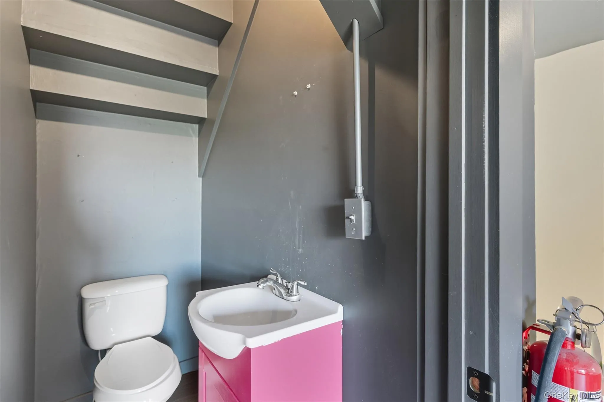 Half bath with vanity and toilet Half bath with vanity and toilet