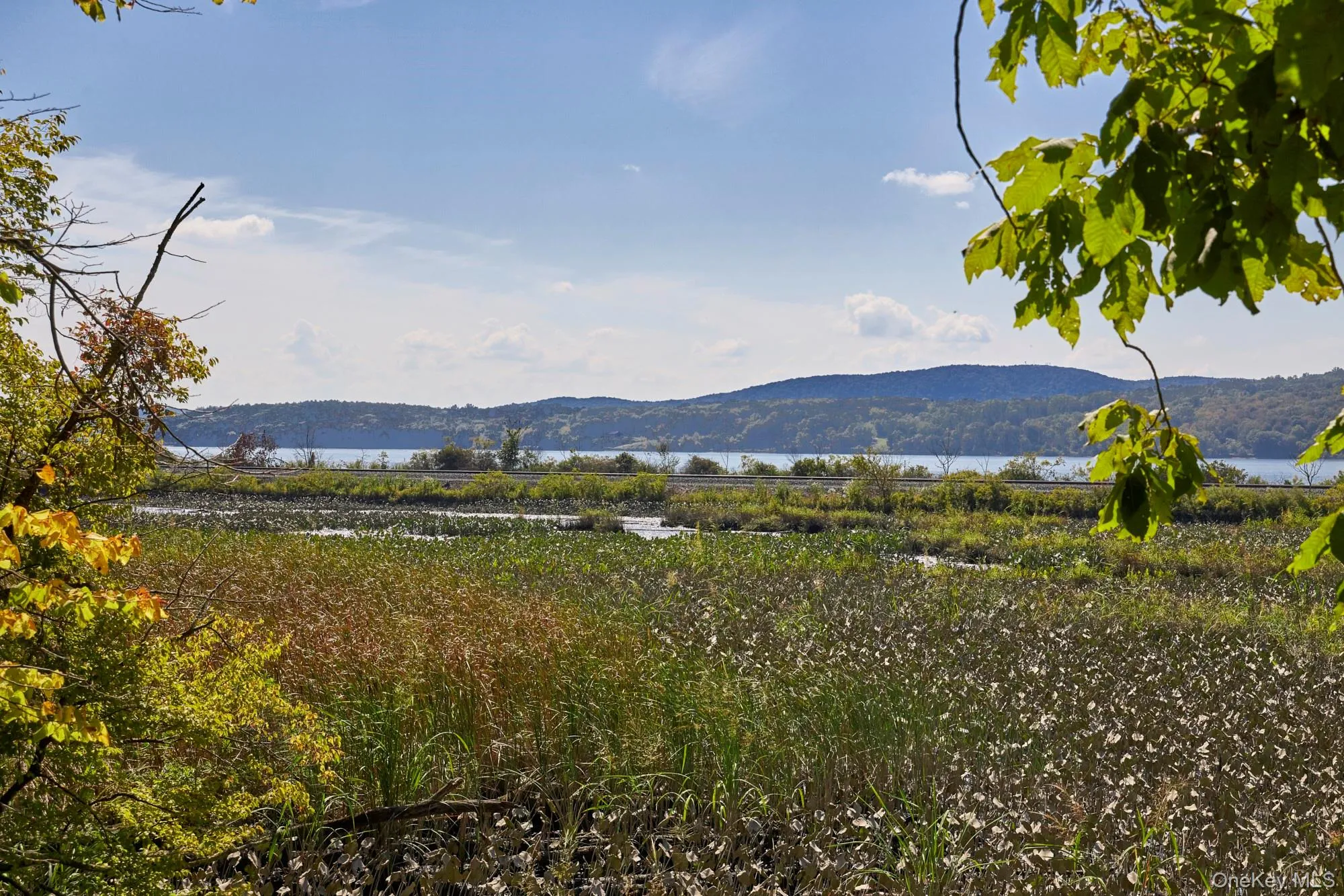 View of mountain backdrop featuring a large body of water View of mountain backdrop featuring a large body of water