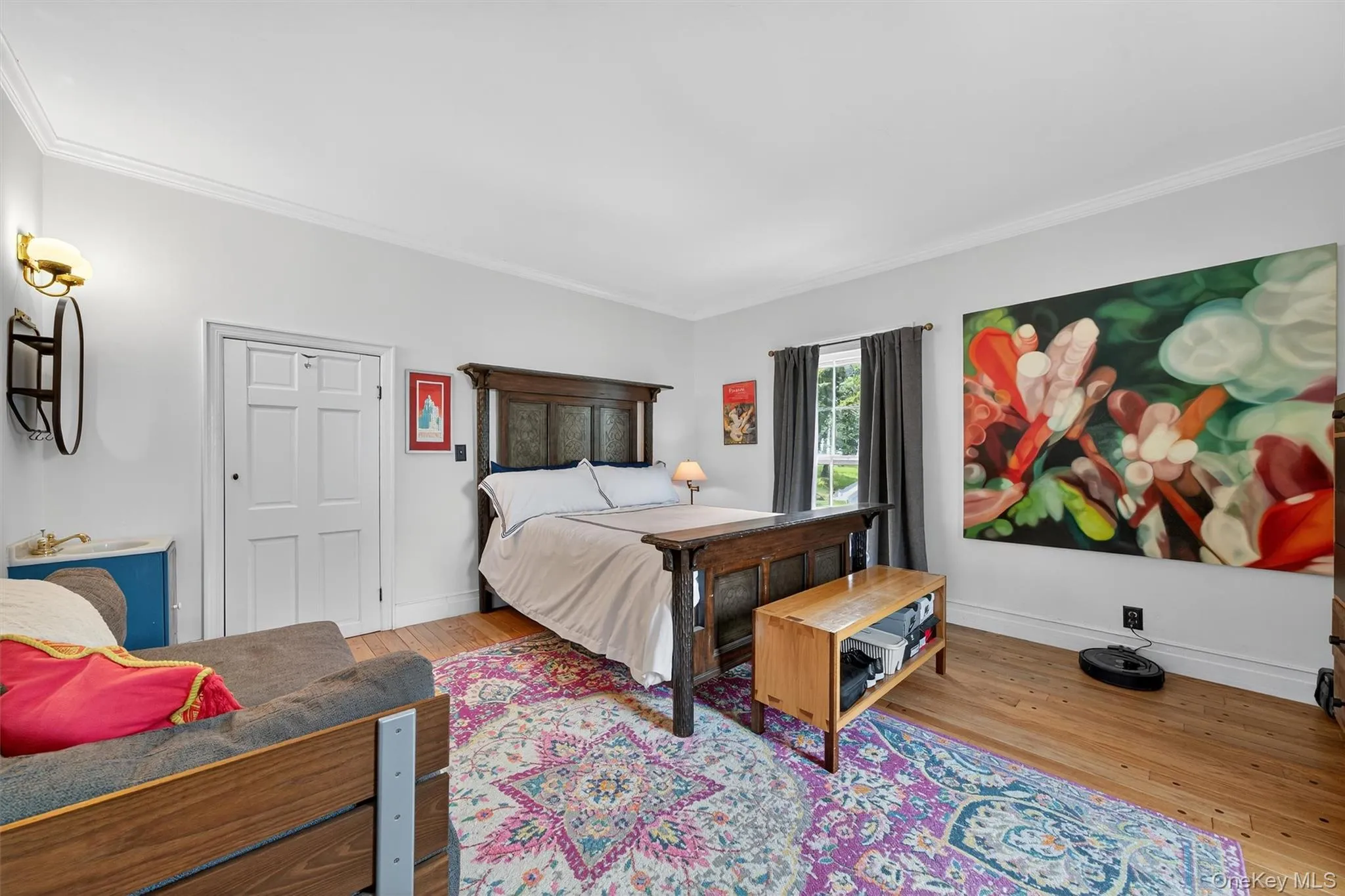 Bedroom featuring hardwood / wood-style flooring and crown molding Bedroom featuring hardwood / wood-style flooring and crown molding