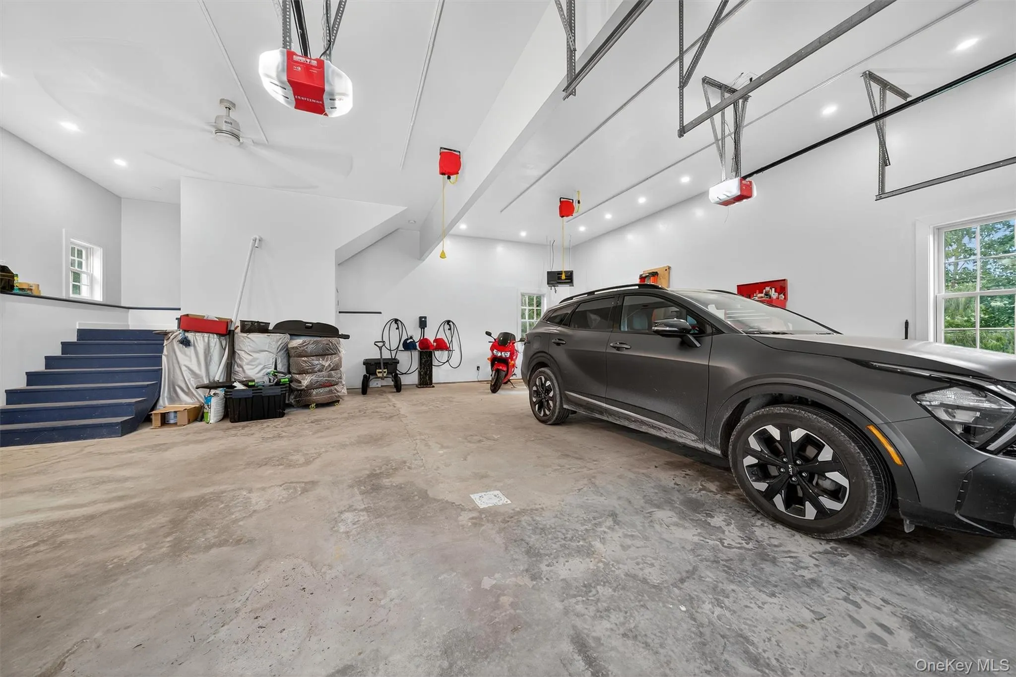 Garage with a garage door opener and recessed lighting Garage with a garage door opener and recessed lighting