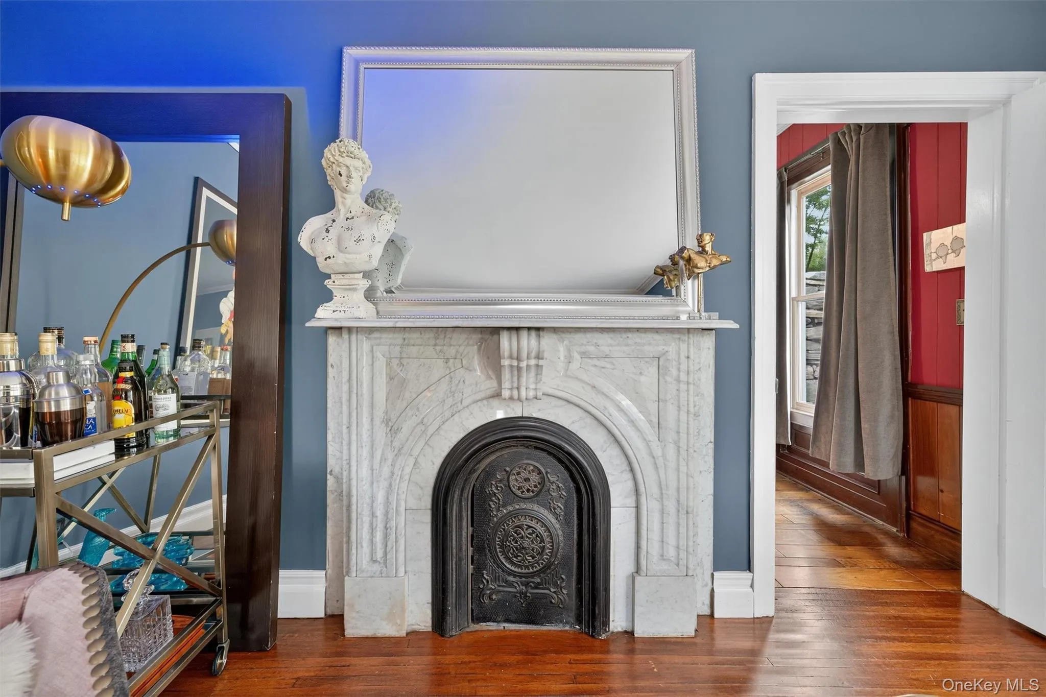 Detailed view of wood finished floors and a fireplace Detailed view of wood finished floors and a fireplace