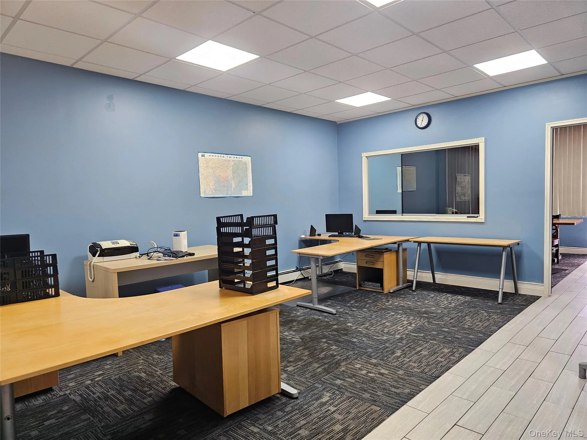 Home office with a paneled ceiling and wood tiled floors Home office with a paneled ceiling and wood tiled floors