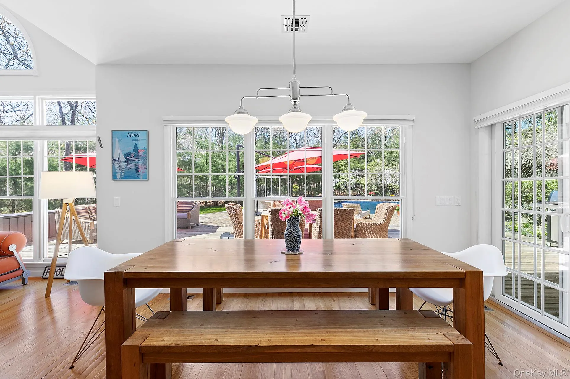 Dining area featuring hardwood / wood-style floors and a chandelier Dining area featuring hardwood / wood-style floors and a chandelier