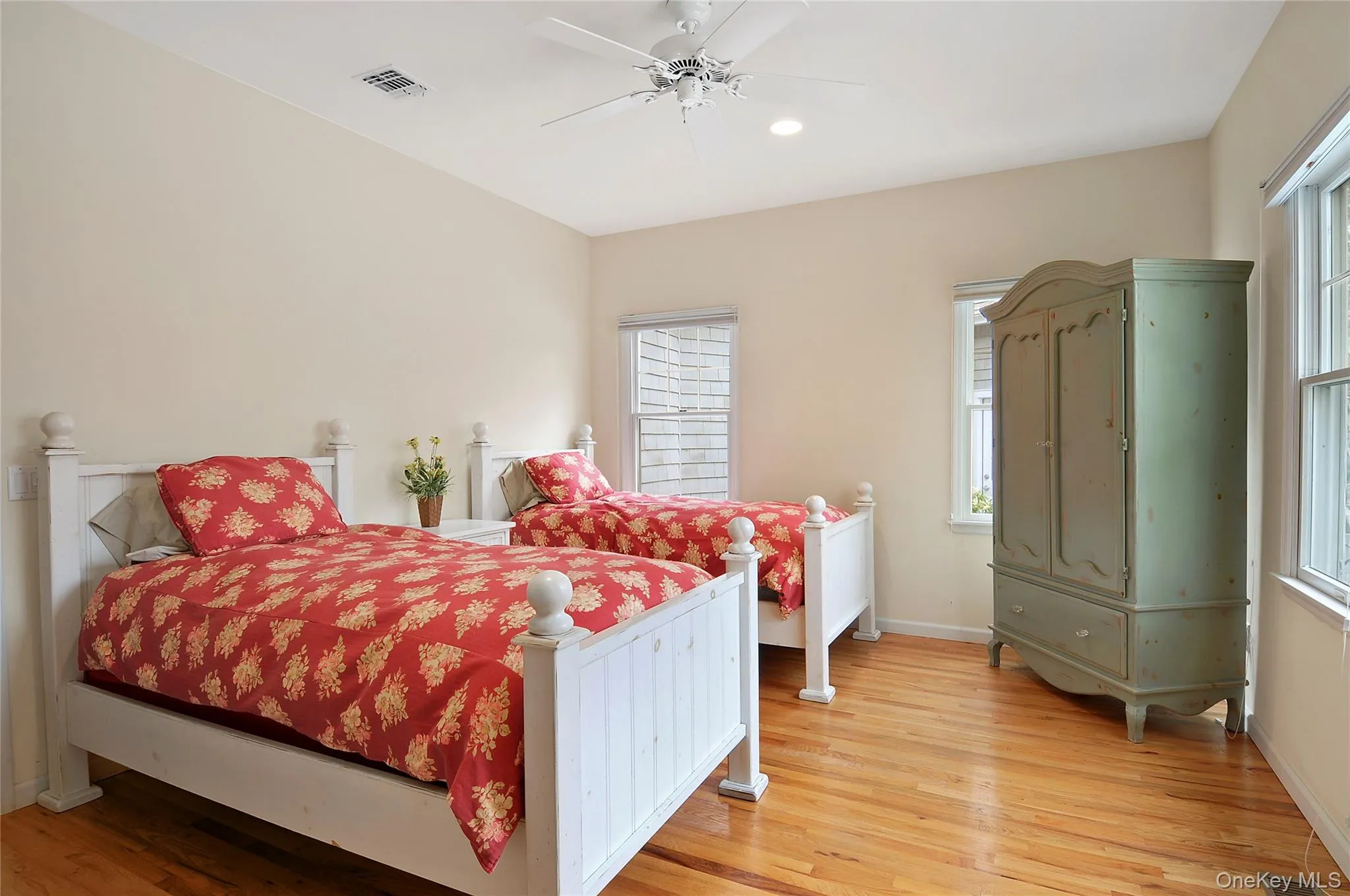 Bedroom featuring light wood-style floors, ceiling fan, and recessed lighting Bedroom featuring light wood-style floors, ceiling fan, and recessed lighting