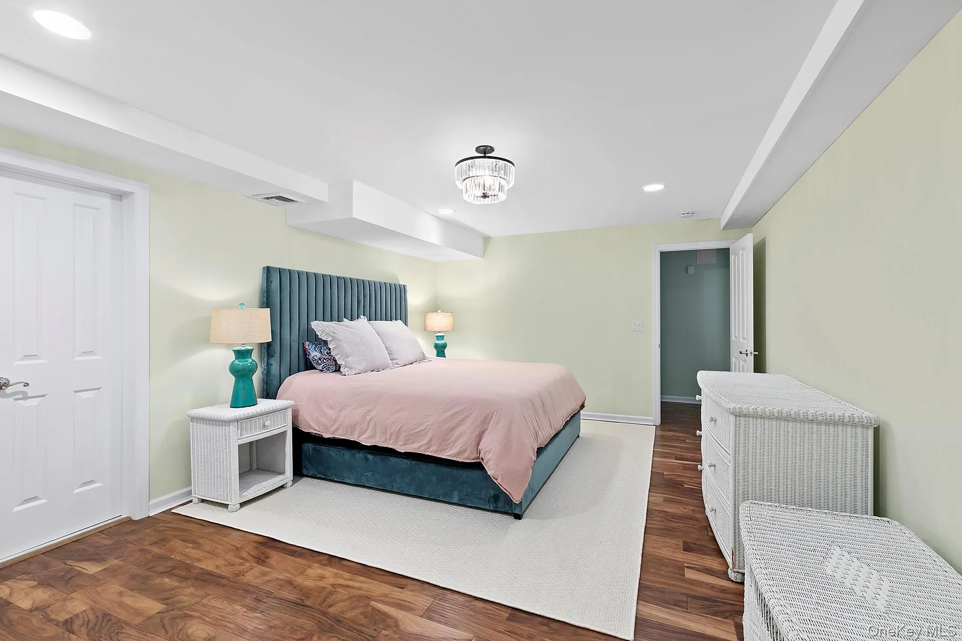 Bedroom with dark wood finished floors, recessed lighting, and a chandelier Bedroom with dark wood finished floors, recessed lighting, and a chandelier