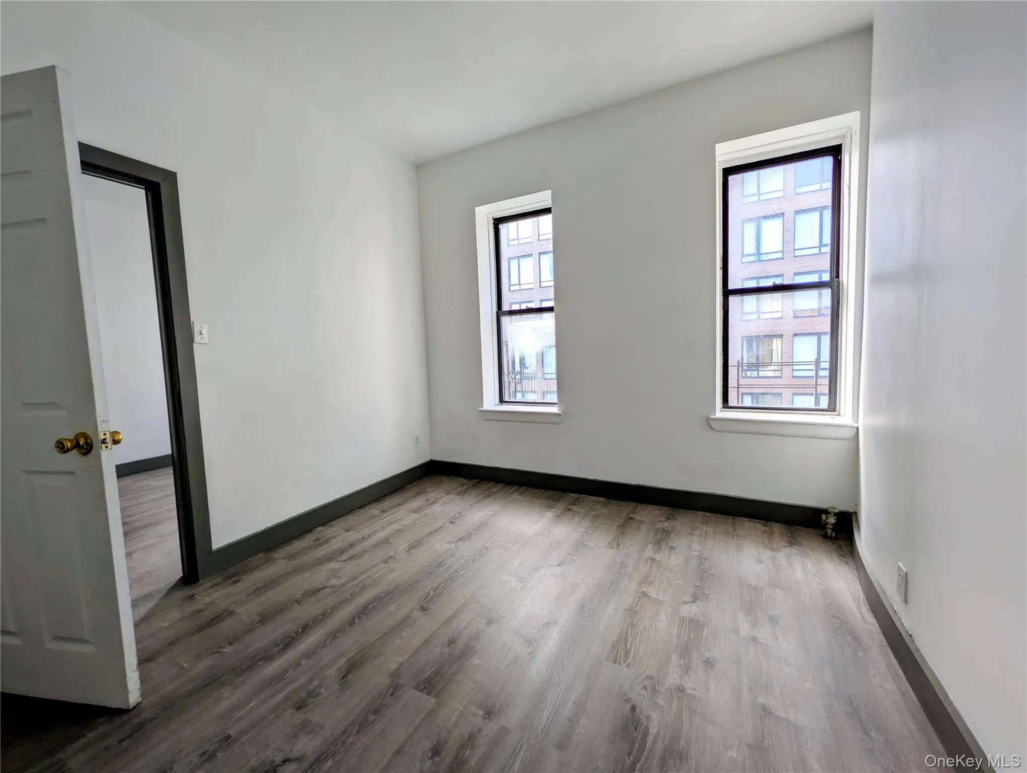 Unfurnished room with light wood-type flooring Unfurnished room with light wood-type flooring