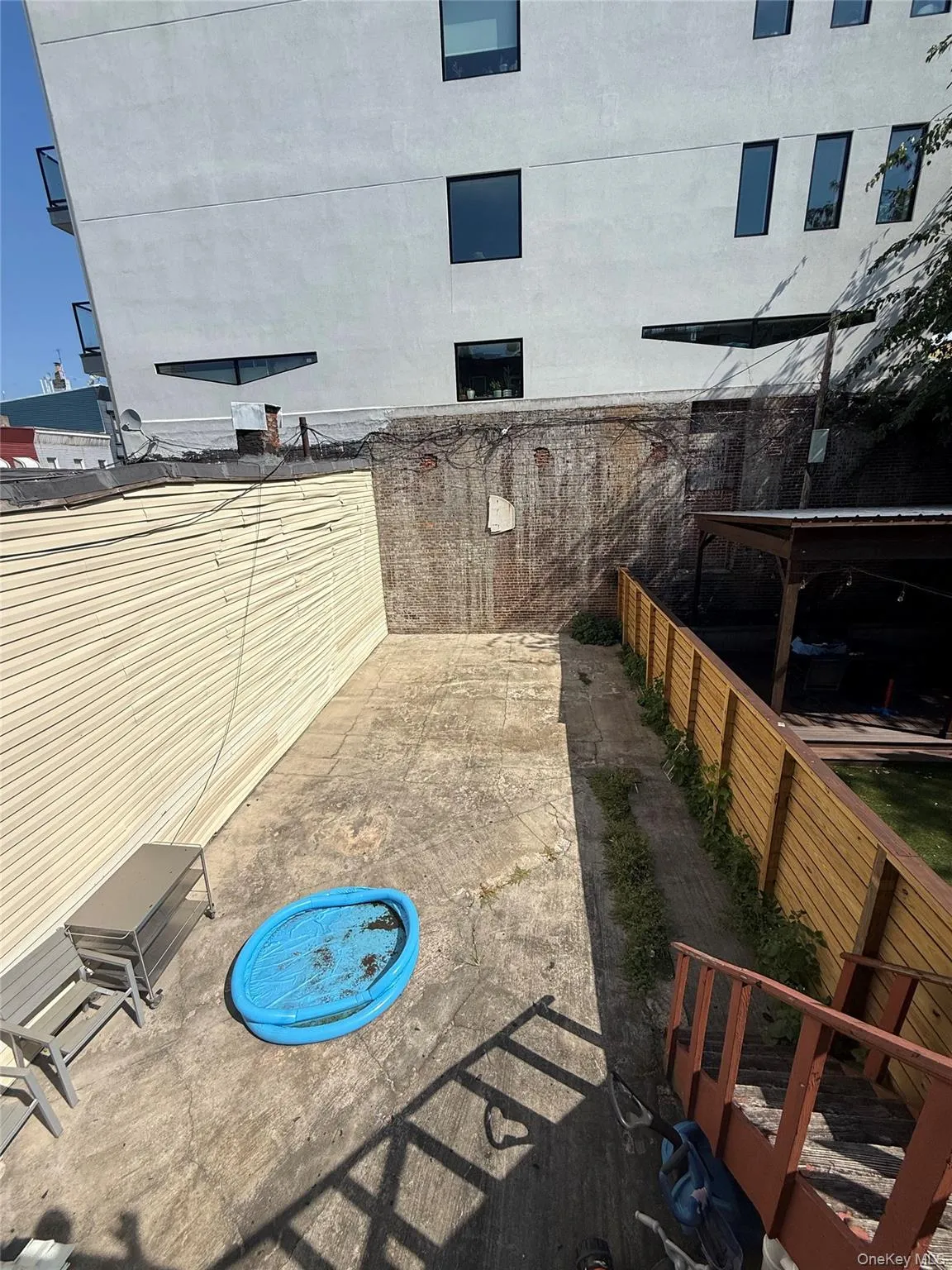 Fenced backyard featuring a patio Fenced backyard featuring a patio