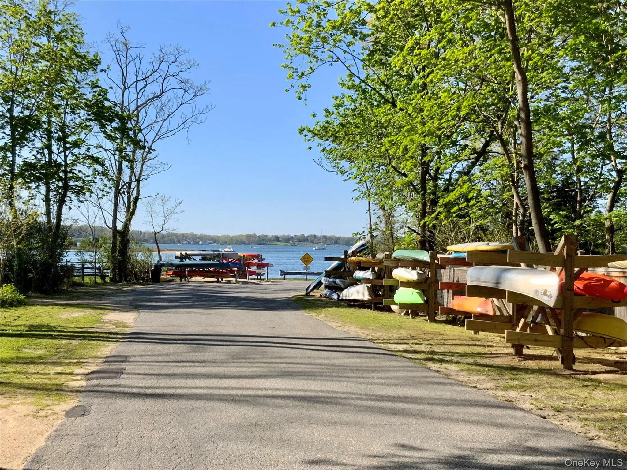 View of road with a water view and a boat ramp View of road with a water view and a boat ramp