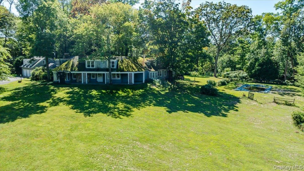 View of grassy yard with covered porch View of grassy yard with covered porch