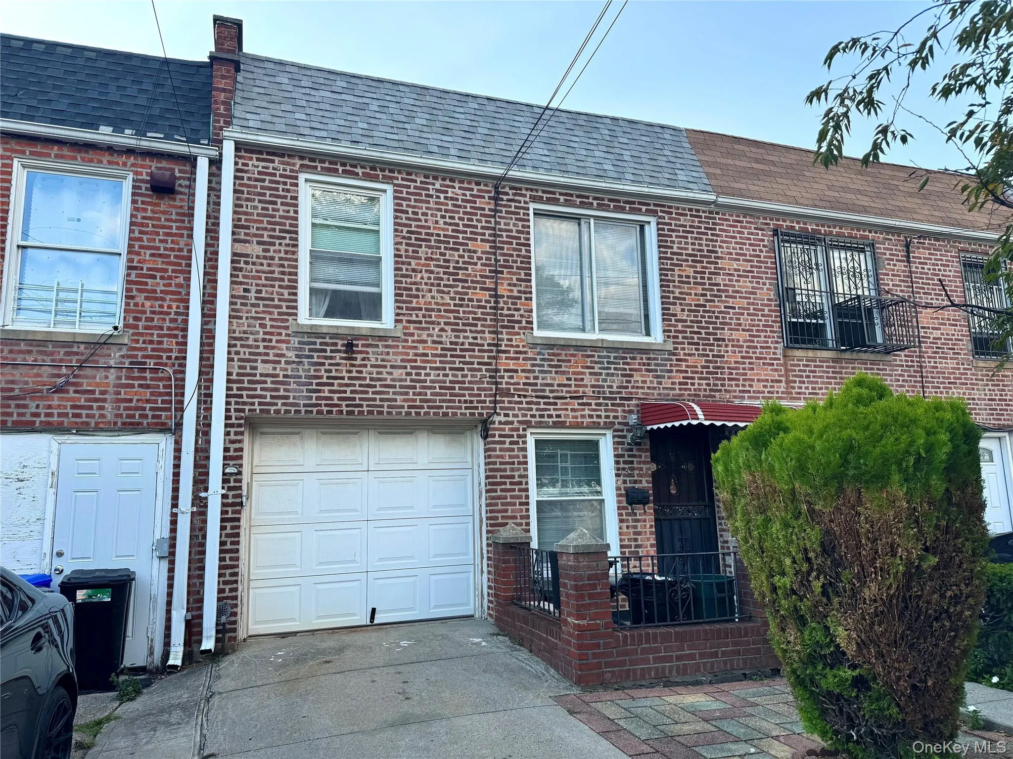 View of front of home - roof, brick siding, driveway, and a garage View of front of home - roof, brick siding, driveway, and a garage