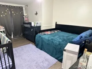 Bedroom with wood finished floors Bedroom with wood finished floors